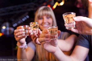 truth or dare stories holding drinks in their hands