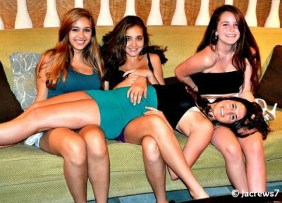 Girl lying on many girls lap