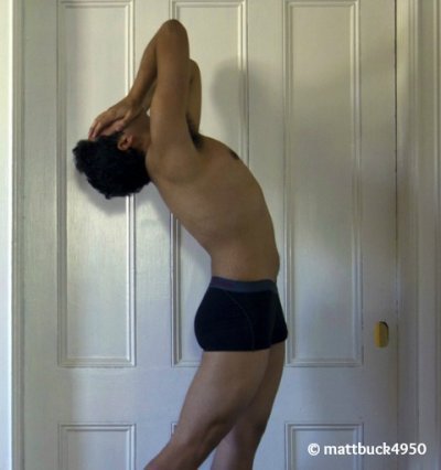 Semi naked guy in front of door while locked outside