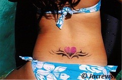 Girl showing her tattoo on the back