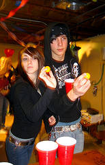Couple playing Beer Pong