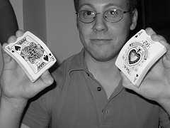 A man showing a King and An Ace Card