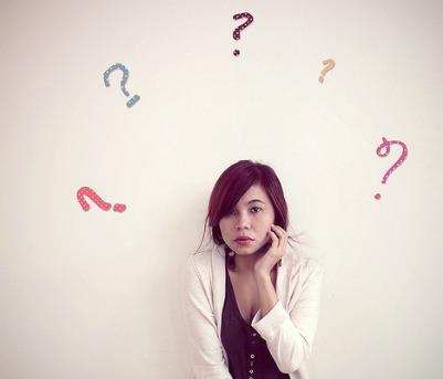 Lady with question marks in the background