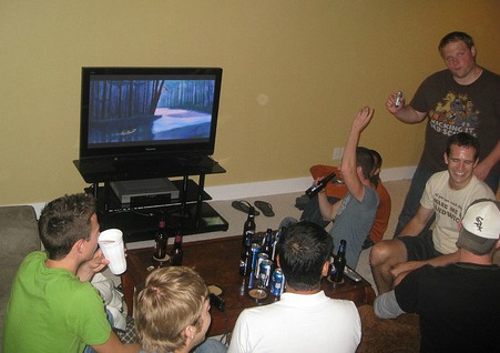 group of friends drinking while watching tv