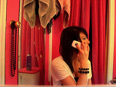 Girl prank calling with her mobile phone