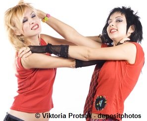Two girls fighting and pulling each other's hair