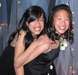 One girl giving piggyback ride to another