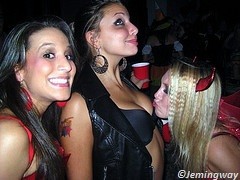 Girl kissing on the breasts of another girl