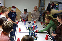 A Large Group of Friends Playing Flip Cup