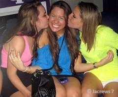 two girls kissing on the cheeks of another girl