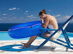 Adult Pool Party Games A girl blowing into a pool tube