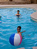 teen pool party games Guy looking behind a ball